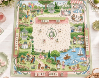 May include: A rectangular mahjong mat featuring a whimsical garden illustration with anthropomorphic animals, gazebos, a pond with sailboats, and musical foxes. The mat includes four translucent pink tile racks and scattered mahjong tiles.