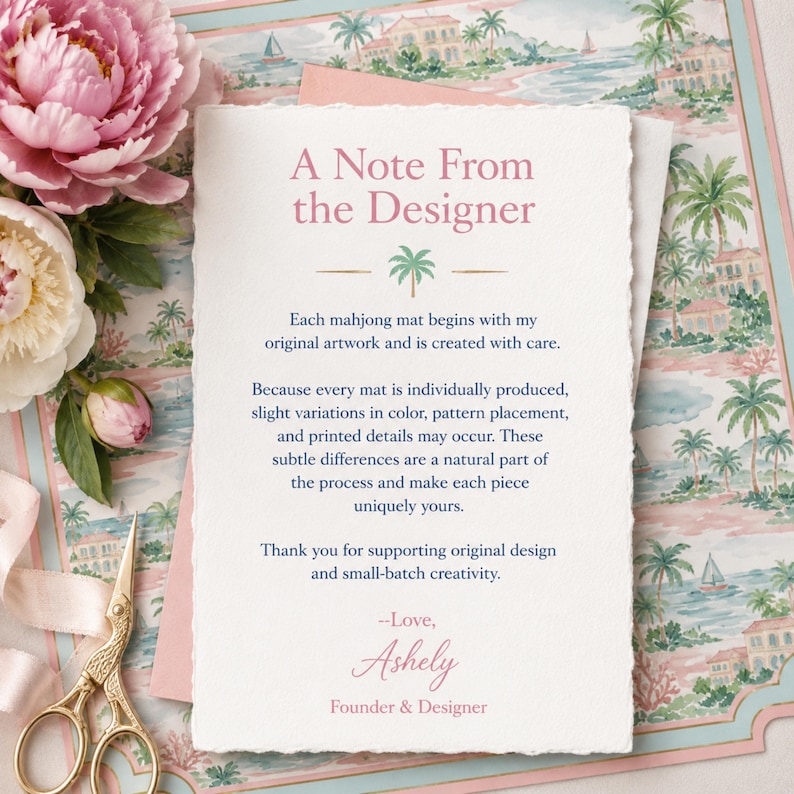 May include: A rectangular note card with deckled edges featuring the text A Note From the Designer in pink, followed by a green palm tree icon and black text explaining the production process, signed by Ashely, Founder & Designer in pink.