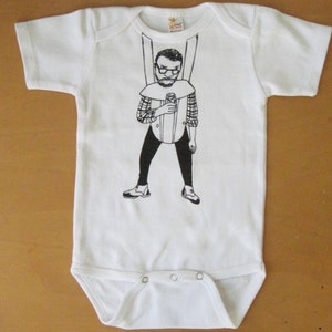 Angry hipster in baby carrier