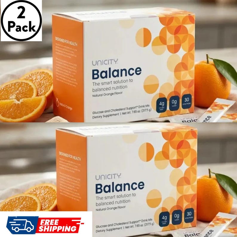 May include: Two boxes of Unicity Balance Glucose and Cholesterol Support drink mix with natural orange flavor. Each box has a net weight of 7.65 oz. The packaging is white and orange with circular patterns, featuring text and three small icons.