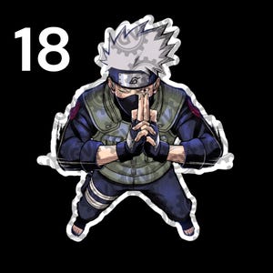 May include: A sticker featuring a character with spiky silver hair, a black face mask, and a headband with a leaf symbol. The character wears a dark blue long-sleeved shirt, a green tactical vest, and dark pants, with hands joined in a hand sign.
