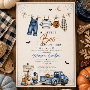 May include: A baby shower invitation card featuring a clothesline with blue overalls, a striped shirt, a pumpkin bucket, and a plaid cloth. Text reads A Little Boo Is Almost Due, honoring Mason Carter, Saturday, October 18, 2026, at 2:00 PM.