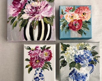 May include: Four small canvas paintings featuring floral arrangements in vases. The paintings are all different colors and styles, with a variety of flowers and vases. The paintings are all on a white background.