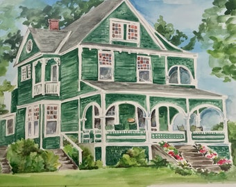 May include: Watercolor painting of a two-story green house with white trim. The house has a gray roof, multiple windows, and a porch with arched openings. Red flowers and green bushes are in the front yard. The sky is blue with some clouds.