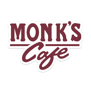 May include: A white sticker with a maroon logo that reads "Monk's Cafe" in a vintage font.
