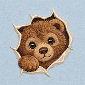 May include: An embroidered patch featuring a brown bear cub peeking through a jagged, torn opening. The bear has dark eyes, a small nose, and one paw visible. The edges of the tear are light cream, set against a solid light blue background.