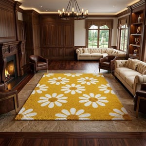 May include: A rectangular area rug featuring a repeating pattern of white daisy flowers on a mustard yellow background. The rug has a textured, shaggy pile surface and is positioned centrally on a stone floor in a room with wood paneling.