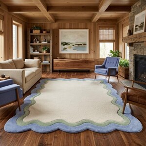 Scalloped wavy edge rug placed in a rustic living room with exposed wooden beams and sunlight streaming in