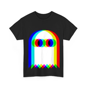 May include: A black short-sleeve t-shirt featuring a central graphic of a white ghost silhouette. The ghost is outlined with overlapping red, blue, and yellow color layers, creating a vibrant chromatic aberration effect with circular eyes.