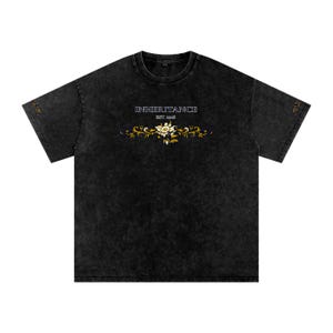 May include: A black acid-wash t-shirt featuring the text INHERITANCE EST. 2018 in white lettering above a gold and white floral graphic. The design includes small floral accents on both sleeves and a crew neckline with a standard short-sleeve cut.