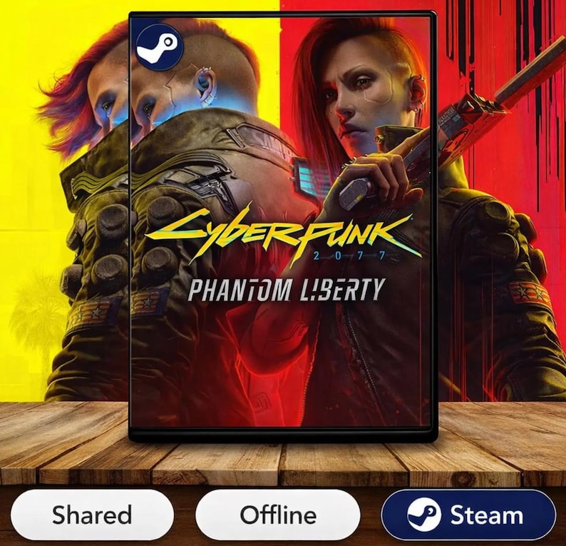 May include: A video game case for Cyberpunk 2077 Phantom Liberty featuring a character with red hair holding a weapon. The cover art displays the game title in yellow and white text against a split yellow and red background with a Steam logo icon.