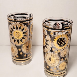 Amazing pair of Fred Press signed MCM High ball glasses. Black and 22k Gold statement pieces. Nice vintage condition.