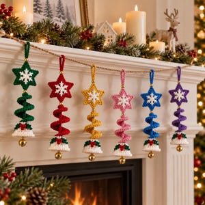 May include: A set of six crocheted Christmas ornaments hanging from a string, each featuring a star with a white snowflake, a spiral body, and a bell at the bottom. The ornaments are in green, red, yellow, pink, blue, and purple with white bells.