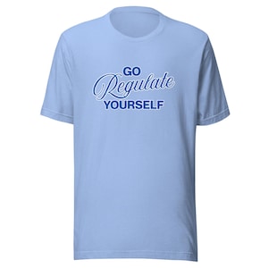 May include: A light blue short-sleeved t-shirt featuring the text GO REGULATE YOURSELF printed in dark blue. The word GO is in a simple sans-serif font, Regulate is in a cursive script, and YOURSELF is in a bold, blocky sans-serif font.