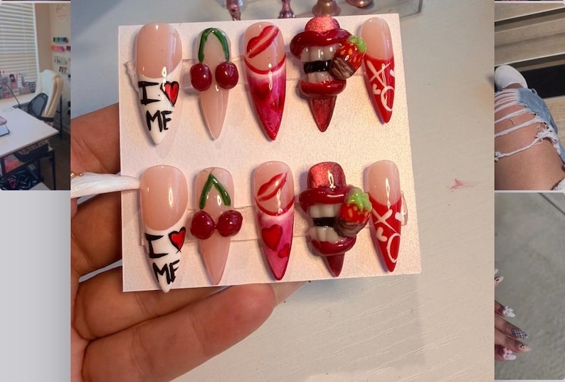 May include: A set of ten stiletto-shaped press-on nails featuring a nude base with red and white designs. Patterns include the text I heart ME, red cherries, red lips, 3D strawberry charms, and white X and O symbols on a red background.