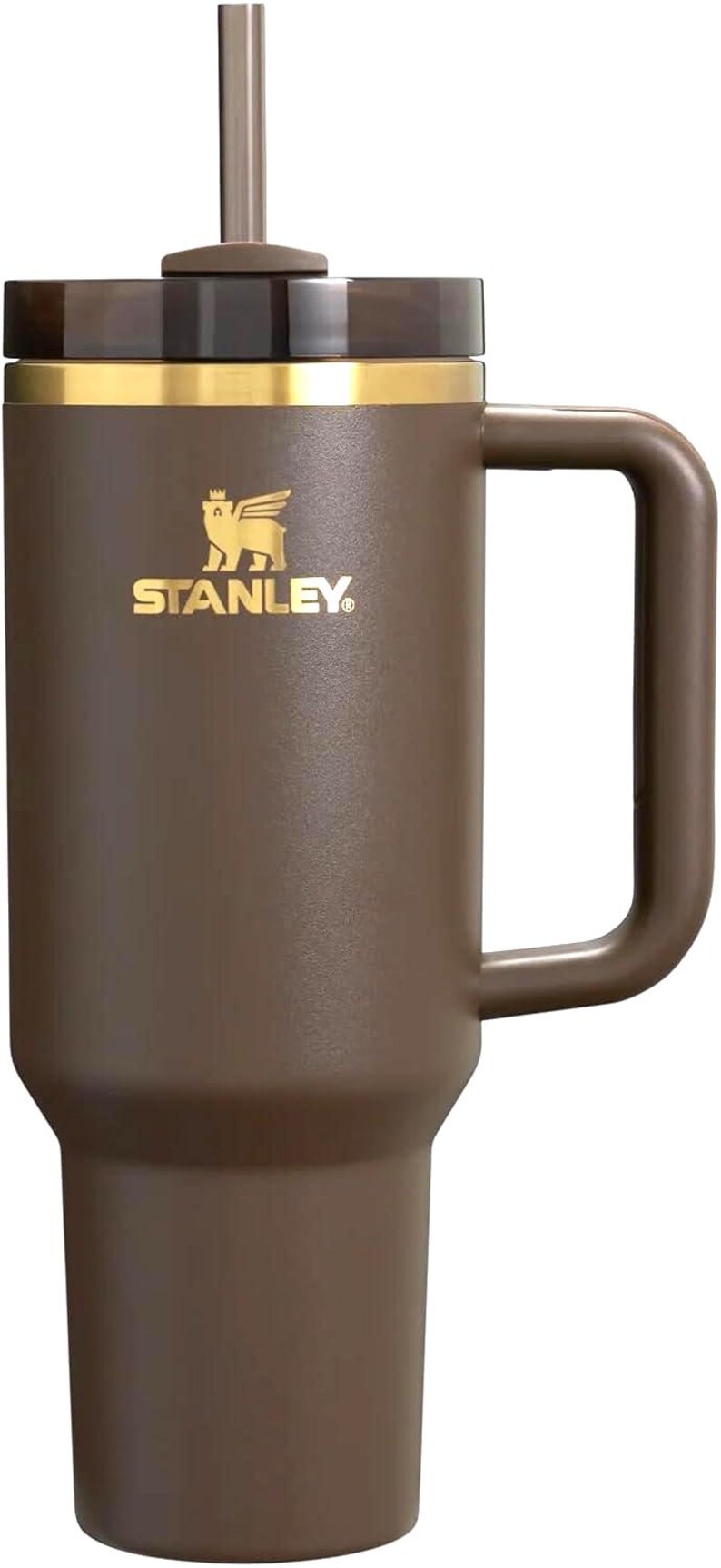 May include: A matte brown insulated tumbler with a large side handle, a matching brown straw, and a dark translucent lid. The upper portion features a gold-coloured band and the Stanley logo with a winged bear emblem printed in gold on the front.
