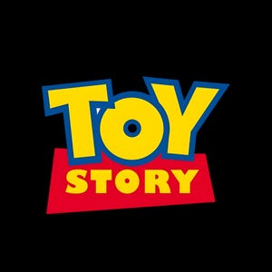 May include: The Toy Story logo features the word TOY in large yellow letters with a thick blue outline, positioned above the word STORY in smaller yellow letters set against a red trapezoidal background, all displayed on a solid black field.