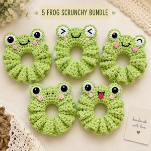 May include: A bundle of five light green crochet scrunchies, each featuring a frog face with black eyes, pink cheeks, and varied expressions including winking, smiling, and sticking out a tongue. The text 5 FROG SCRUNCHY BUNDLE is visible.