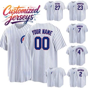 May include: A white baseball jersey with thin blue pinstripes, a button-down front, and a blue circular logo on the sleeve. The back displays the text YOUR NAME and the number 00 in blue with red outlines. Additional jerseys show various names and numbers.