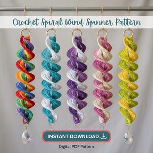 May include: Five crochet spiral wind spinners hanging from a rod, each with a gold ring at the top and a clear crystal at the bottom. The spinners feature color combinations of rainbow, teal and white, purple and white, pink and white, and yellow and green. Text reads: Crochet Spiral Wind Spinner Pattern and INSTANT DOWNLOAD.