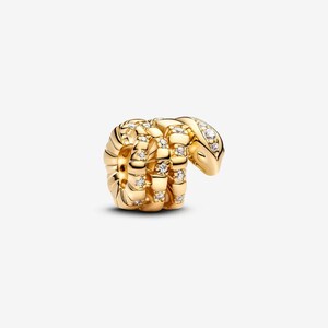 May include: A gold-toned snake-shaped charm bead featuring a coiled body design. The surface is embellished with multiple small, clear, round-cut stones set along the length of the snake, including its head, creating a sparkling effect.