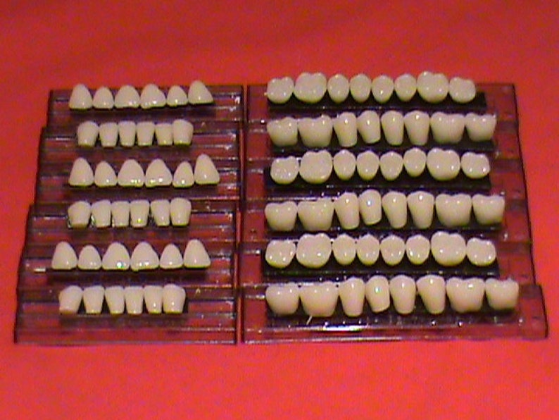 Искусственные зубы. Набор искусственных зубов. Пластмассовые зубы. Гарнитуры зубов для съёмных протезов.