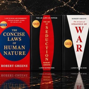 May include: A collection of five books by Robert Greene arranged side-by-side. The titles include Mastery, The Concise Laws of Human Nature, The Art of Seduction, The 33 Strategies of War, and The 48 Laws of Power, featuring bold red, black, and white covers.