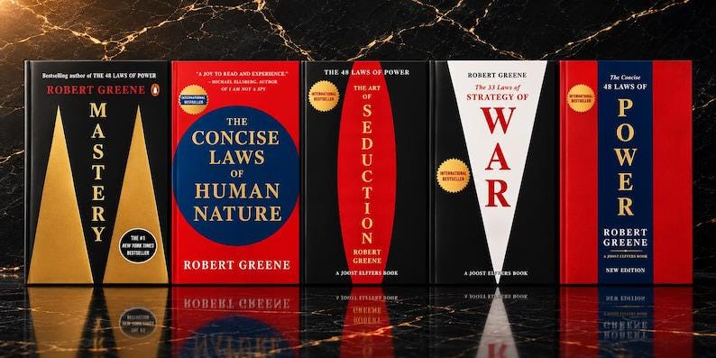 May include: A collection of five books by Robert Greene arranged side-by-side. The titles include Mastery, The Concise Laws of Human Nature, The Art of Seduction, The 33 Strategies of War, and The 48 Laws of Power, featuring bold red, black, and white covers.