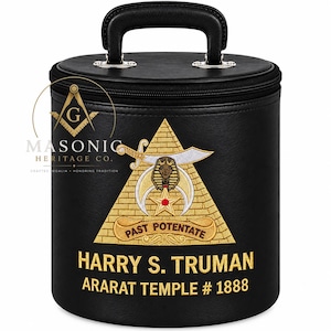 May include: A black cylindrical carrying case with a top handle and zip closure. The front features an embroidered gold pyramid emblem with a sword, crescent, and star, plus the text "PAST POTENTATE", "HARRY S. TRUMAN", and "ARARAT TEMPLE # 1888".