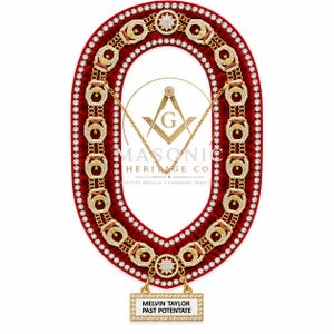 May include: A ceremonial collar featuring a red velvet oval base bordered by clear rhinestones. It includes gold-toned metal links with star and crescent motifs, a central star emblem, and a rectangular nameplate reading MELVIN TAYLOR PAST POTENTATE.
