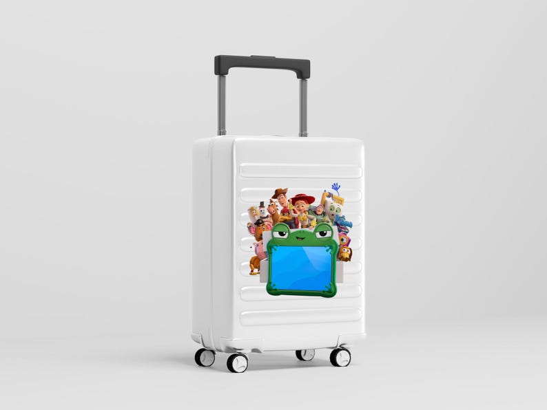 May include: A white rolling suitcase with a retractable handle and four wheels. The front features a graphic print of various animated characters from the Toy Story franchise positioned above a green frog-shaped frame with a blue center.