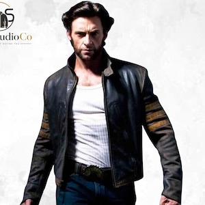 May include: A dark brown leather jacket featuring a high collar, a front zipper closure, and three horizontal tan stripes on each sleeve. The jacket is worn over a white ribbed tank top and dark blue jeans with a black belt featuring a large buckle.