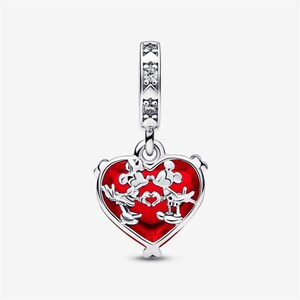 May include: A silver charm featuring a heart-shaped red translucent center with a metallic overlay of two cartoon characters forming a heart shape with their hands. The bail is decorated with small clear stones set in a star-shaped pattern.