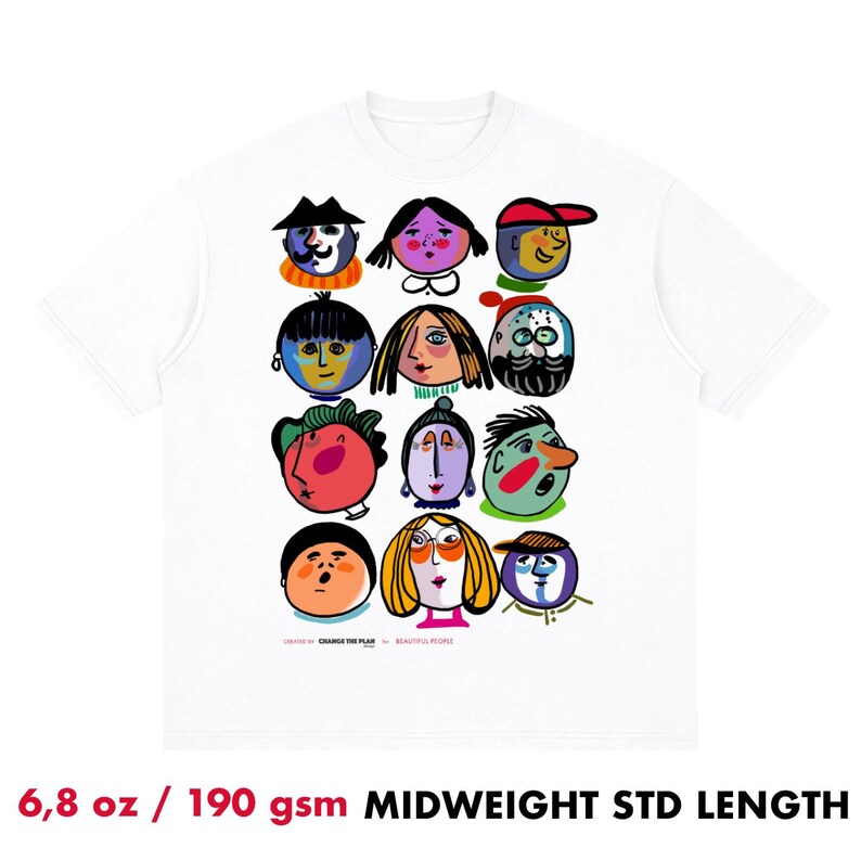 May include: A white short-sleeve t-shirt featuring a graphic print of twelve stylized, colorful faces arranged in a grid. The text "CREATED BY CHANGE THE PLAN FOR BEAUTIFUL PEOPLE" is printed in small black letters at the bottom of the graphic design.