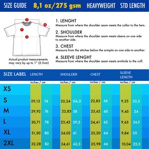 May include: A size guide chart for a t-shirt featuring a line drawing of the garment with numbered measurement points. The chart displays length, shoulder, chest, and sleeve length in inches and centimeters for sizes XS through 2XL, 8.1 oz/275 gsm.