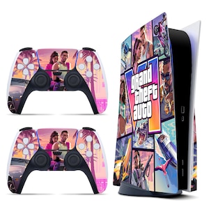 May include: A gaming console and two wireless controllers featuring a Grand Theft Auto V skin. The skin displays a collage of characters, palm trees, vehicles, and the game logo in vibrant shades of purple, pink, orange, and blue against a white base.