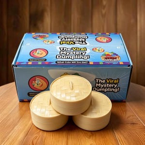 One Mystery Bao Bun knijpspeeltje met glitterafwerking en blij gezicht