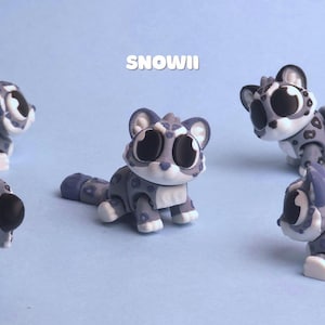 May include: Five articulated snow leopard figurines with large black eyes and grey fur featuring dark grey spots. The figures are posed in various positions, including sitting and lying down. The text SNOWII is centred above the central figure.