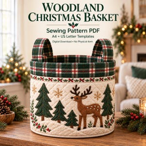May include: A quilted fabric basket featuring a Woodland Christmas Basket sewing pattern. The design includes a brown deer, green pine trees, and gold snowflakes on a cream background, with a green, red, and white plaid rim and two handles.