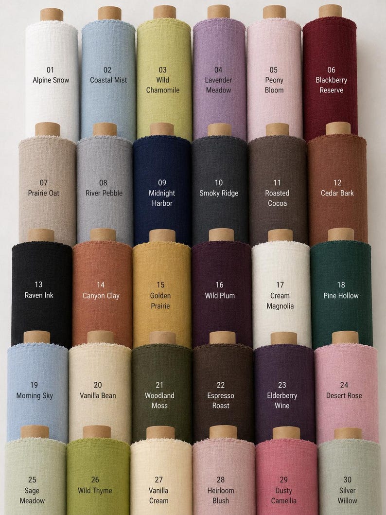 May include: A collection of thirty fabric bolts arranged in a grid, each labeled with a number and color name. The colors include white, blue, green, purple, pink, red, beige, gray, navy, charcoal, brown, black, orange, yellow, and cream.