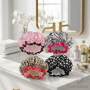 May include: Four shower caps with elasticized edges. One is light pink with dark brown polka dots and a brown ruffle. One features a black and white zebra print with a hot pink ruffle. One has a leopard print with a hot pink ruffle. One is black with white polka dots.
