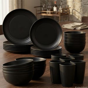 May include: A matte black dinnerware set consisting of large dinner plates, smaller salad plates, deep bowls, and tall drinking tumblers. Each piece features a series of concentric circular ridges along the edges, creating a uniform, textured appearance across the entire collection.