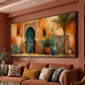 May include: A large rectangular wall art print featuring a textured orange and blue wall with an arched teal door, intricate tile patterns, a tall palm tree, and two ceramic vases. The scene depicts a warm, weathered architectural setting.