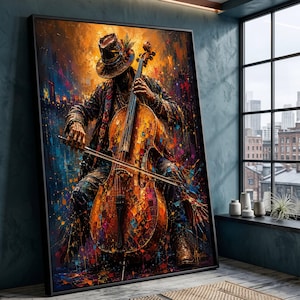 May include: A framed wall art print featuring an abstract, colorful oil painting of a musician playing a cello. The figure wears a hat and textured clothing, rendered in vibrant orange, blue, and purple paint splatters against a dark background.