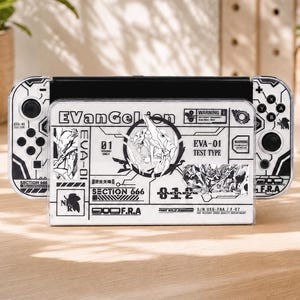 May include: A white and black gaming console dock and controller set featuring Evangelion-themed graphics. The dock displays text including EVANGELION, EVA-01 TEST TYPE, SECTION 666, and various technical symbols. The controllers have matching monochrome designs.