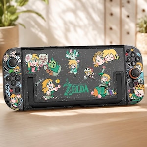 May include: A black handheld gaming console featuring a decorative skin with various cartoon-style illustrations of characters from The Legend of Zelda, including the green logo text in the center, surrounded by multiple small, colorful character decals.