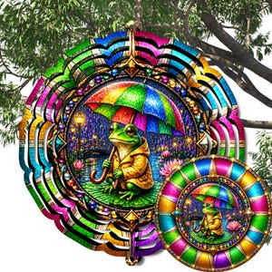 May include: A circular metal wind spinner featuring a vibrant, multi-colored graphic of a green frog wearing a yellow raincoat and holding a rainbow umbrella. The design includes a pond setting with water lilies, a bridge, and glowing lanterns.