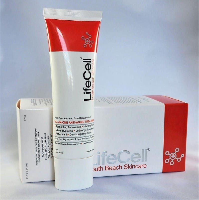 May include: A white and red tube of LifeCell South Beach Skincare all-in-one anti-aging treatment next to its matching rectangular box. The packaging displays the text LifeCell, 75 ml, and net wt 2.54 oz, along with product benefit details.