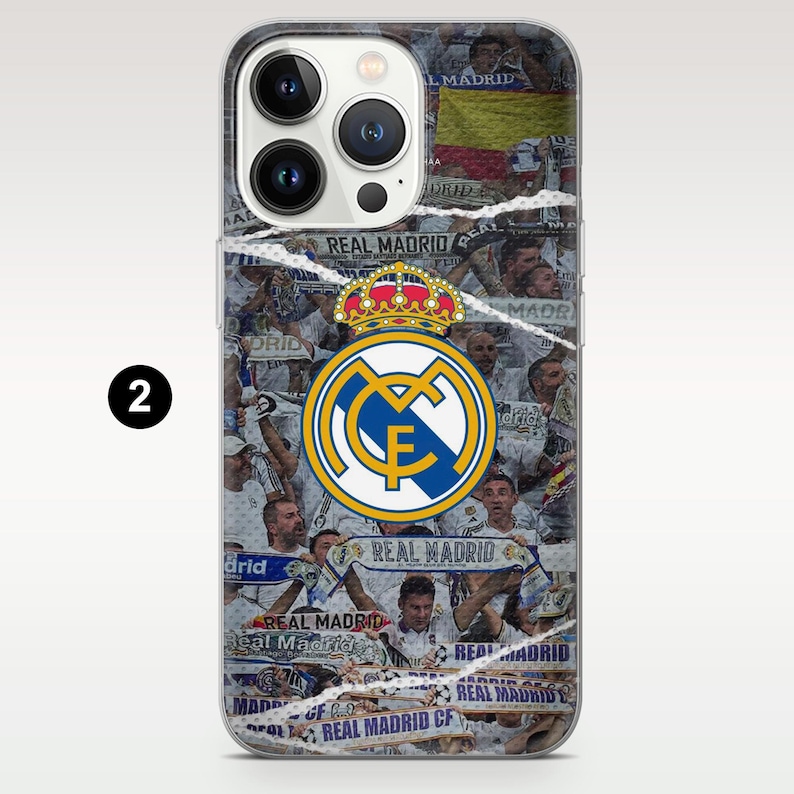 May include: A clear smartphone case featuring a collage of Real Madrid soccer fans and scarves with the text Real Madrid. The center displays the official Real Madrid crest in blue, gold, and white, topped with a crown, over a white background.