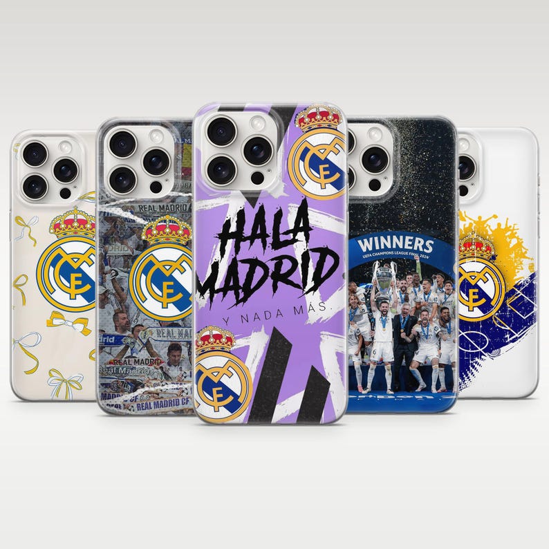 May include: Five smartphone cases featuring Real Madrid CF branding. Designs include the club crest, a collage of players, the text HALA MADRID Y NADA M&Aacute;S, a team celebration photo with the text WINNERS, and a yellow and blue graphic pattern.